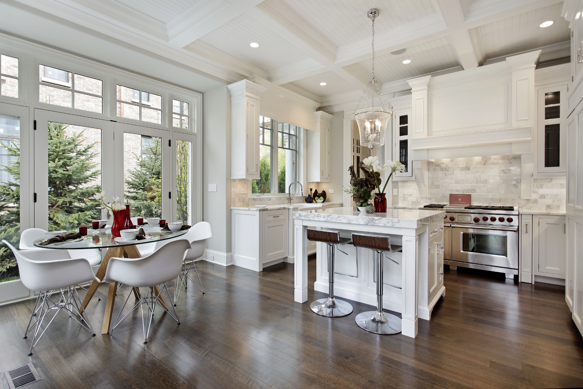 Kitchen in luxury home with white cabinetry. What improvements should you make before you list your home for sale?
